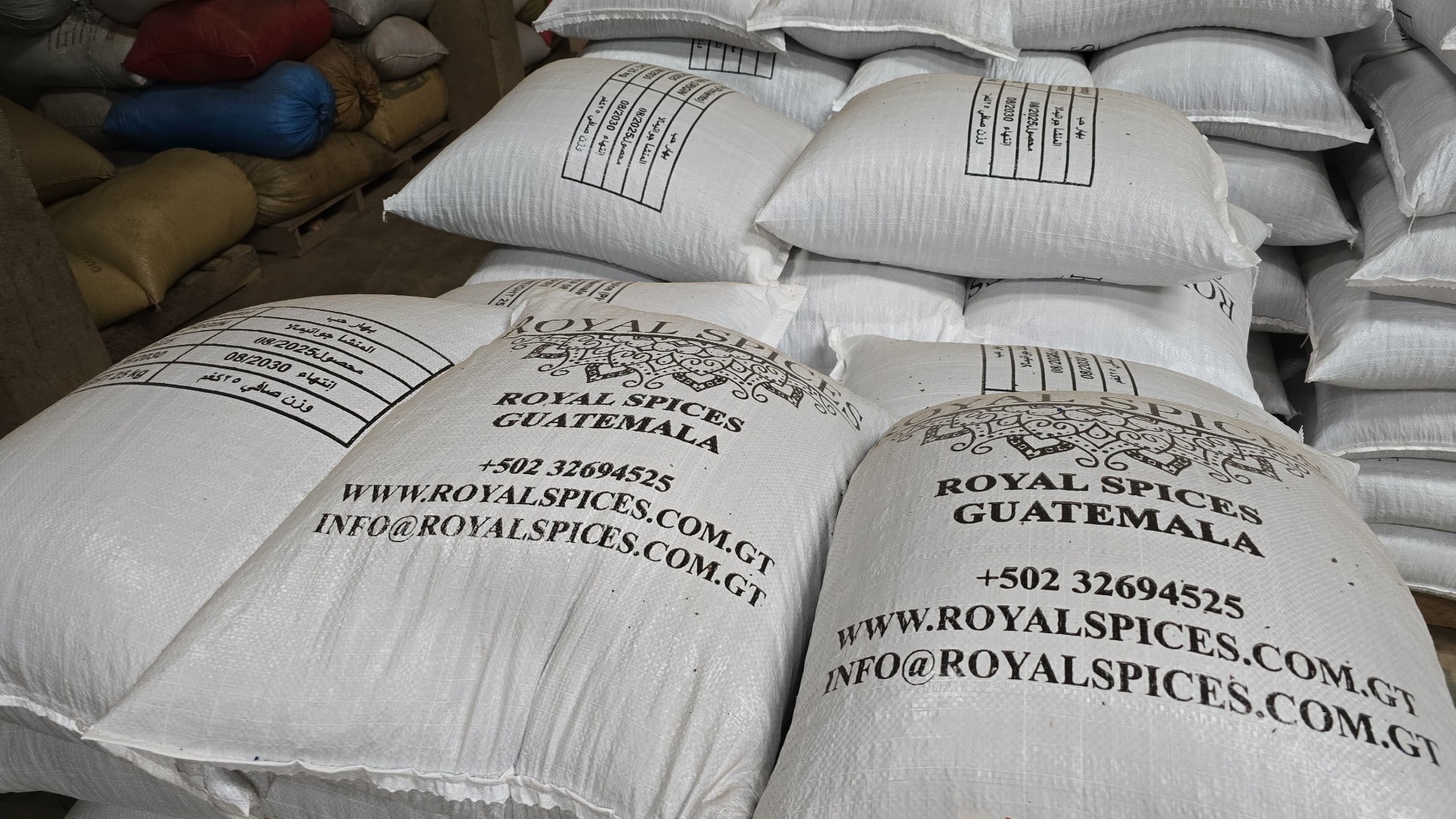 White branded Royal Spices cardamom sacks in warehouse